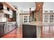 An open kitchen concept features granite countertops, stainless appliances, and a stone accent wall at 3249 Ivey Creek Rd, Maiden, NC 28650