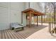 Inviting outdoor deck with covered seating area, perfect for relaxing and enjoying the natural surroundings at 3249 Ivey Creek Rd, Maiden, NC 28650
