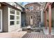 Charming outdoor living area with stone accents, fire pit, water feature, and string lights for evening ambiance at 3249 Ivey Creek Rd, Maiden, NC 28650