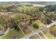 Expansive aerial view of property featuring a cozy home, surrounding trees, and a long driveway at 325 Hurley School Rd, Salisbury, NC 28147