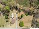 Aerial view of a secluded home with a long driveway and a large, grassy yard at 325 Hurley School Rd, Salisbury, NC 28147