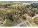 Expansive aerial view of property featuring a cozy home, surrounding trees, and a long driveway at 325 Hurley School Rd, Salisbury, NC 28147