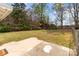 Spacious backyard featuring a chain-link fence, mature trees, and a shed in a private setting at 325 Hurley School Rd, Salisbury, NC 28147