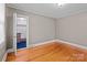 This bedroom has wood floors, a neutral paint color and a closet for storage at 325 Hurley School Rd, Salisbury, NC 28147