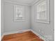 This bedroom has hard wood floors and plenty of natural light with two windows at 325 Hurley School Rd, Salisbury, NC 28147