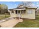 Charming yellow home featuring a fenced yard and a well-maintained lawn in a suburban neighborhood at 325 Hurley School Rd, Salisbury, NC 28147