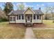 Charming single-story home with a welcoming front porch, mature landscaping, and a well-maintained yard at 325 Hurley School Rd, Salisbury, NC 28147