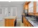 This kitchen features black countertops, stainless appliances, and an island at 325 Hurley School Rd, Salisbury, NC 28147