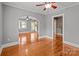 Open-concept living space with hardwood floors, archway and views of connecting rooms at 325 Hurley School Rd, Salisbury, NC 28147
