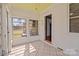 Bright sun room with white walls, tiled floors, and lots of windows at 325 Hurley School Rd, Salisbury, NC 28147