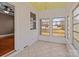 Another view of the bright sun room showcasing neutral decor, large windows and tiled flooring at 325 Hurley School Rd, Salisbury, NC 28147