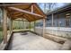 Charming backyard patio area with a rustic wooden covering and a cozy stone fire pit for relaxing outdoors at 3846 Bent Creek Sw Dr # 58, Concord, NC 28027