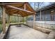 Charming backyard patio area with a rustic wooden covering and a cozy stone fire pit for relaxing outdoors at 3846 Bent Creek Sw Dr # 58, Concord, NC 28027