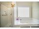 Bright bathroom with soaking tub, separate shower, and window at 3846 Bent Creek Sw Dr # 58, Concord, NC 28027