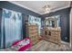 Comfortable main bedroom with light wood dressers and blue decor at 3846 Bent Creek Sw Dr # 58, Concord, NC 28027