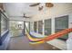Relaxing screened-in porch with a hammock, multiple ceiling fans, and views of the surrounding greenery at 3846 Bent Creek Sw Dr # 58, Concord, NC 28027