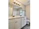 Bathroom featuring double sinks, granite countertops, and white cabinets at 6008 Grassy Knoll Cir, Matthews, NC 28104