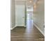 Welcoming hallway with wood-look flooring leads to other rooms in the house at 6008 Grassy Knoll Cir, Matthews, NC 28104