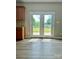Bright kitchen featuring access to the back yard and a view of the well manicured outdoor space at 6008 Grassy Knoll Cir, Matthews, NC 28104
