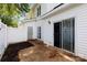 Cozy backyard patio featuring a privacy fence and a sliding glass door to the house at 6359 Mallard View Ln, Charlotte, NC 28269