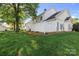 Exterior shot of a backyard featuring a privacy fence and lush green grass, offering a serene outdoor space at 6359 Mallard View Ln, Charlotte, NC 28269