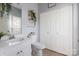 Well-lit bathroom featuring modern fixtures and ample storage space at 6359 Mallard View Ln, Charlotte, NC 28269
