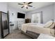 Bedroom featuring grey walls, carpet, ceiling fan, and large bed at 6359 Mallard View Ln, Charlotte, NC 28269