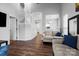Open-concept living room featuring hardwood floors and staircase at 6359 Mallard View Ln, Charlotte, NC 28269