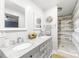 Bright bathroom with double vanities, granite counters, and tiled walk-in shower at 6741 Stillmeadow Dr, Charlotte, NC 28277