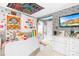 Colorful bedroom featuring a full bed, TV, colorful tapestry and decorations at 6741 Stillmeadow Dr, Charlotte, NC 28277