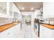 Bright kitchen showcasing white cabinets, butcher block countertops, and stainless appliances at 6741 Stillmeadow Dr, Charlotte, NC 28277