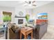 Cozy living room featuring a stone fireplace and comfortable seating arrangement at 6741 Stillmeadow Dr, Charlotte, NC 28277