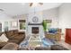 Spacious living room with a vaulted ceiling, stone fireplace, and ample seating at 6741 Stillmeadow Dr, Charlotte, NC 28277