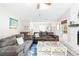 Cozy living room features plush sofas, a decorative fireplace, and an open floor plan at 6741 Stillmeadow Dr, Charlotte, NC 28277