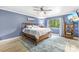 Tranquil bedroom with a ceiling fan, large window, and cozy decor at 6741 Stillmeadow Dr, Charlotte, NC 28277