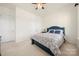 Comfortable bedroom featuring neutral carpet, natural light, and a calming, inviting atmosphere at 7130 Irongate Dr, Indian Land, SC 29707