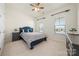 Comfortable bedroom featuring neutral carpet, natural light, and a calming, inviting atmosphere at 7130 Irongate Dr, Indian Land, SC 29707