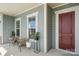 Comfortable seating on the covered front porch, perfect for relaxing and enjoying the neighborhood views at 7130 Irongate Dr, Indian Land, SC 29707