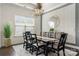 Stylish dining room featuring a large wooden table, designer lighting, and an accent wall with geometric details at 7130 Irongate Dr, Indian Land, SC 29707