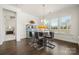 Modern dining room with a glass table, contemporary chairs, and ample natural light at 7130 Irongate Dr, Indian Land, SC 29707