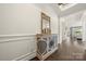 Elegant entryway with dark hardwood floors, decorative cabinet, and inviting sightlines into the living space at 7130 Irongate Dr, Indian Land, SC 29707