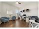 Bright home office with modern decor, built-in shelving, and hardwood floors; a perfect workspace at 7130 Irongate Dr, Indian Land, SC 29707