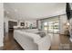 Expansive living room with access to the backyard via sliding glass doors and an open-concept kitchen at 7130 Irongate Dr, Indian Land, SC 29707