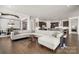 Open-concept living room and kitchen area with hardwood floors and abundant natural light at 7130 Irongate Dr, Indian Land, SC 29707