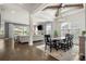 Spacious living space showcasing an open floor plan, a dining area, and a cozy living room with a fireplace at 7130 Irongate Dr, Indian Land, SC 29707