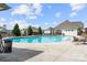 A spacious community pool with lounge chairs for relaxing and enjoying the sun at 7130 Irongate Dr, Indian Land, SC 29707