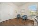 Cozy sitting area with hardwood floors, natural light, and stylish seating, perfect for relaxation at 7130 Irongate Dr, Indian Land, SC 29707