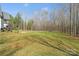 Expansive backyard surrounded by mature trees offers privacy at 722 Clegg Farm Dr, York, SC 29745