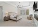 Tranquil bedroom with recessed lighting, tray ceiling, a cozy chair, and a large window view at 722 Clegg Farm Dr, York, SC 29745