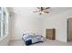 Bright bedroom features a ceiling fan, neutral walls, and a comfortable bed with a patchwork quilt at 722 Clegg Farm Dr, York, SC 29745
